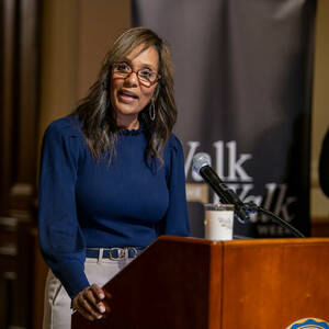 Salima Rockwell speaks at a podium