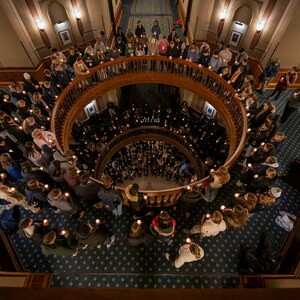 People gathered around the three floors of the rotunda, as seen from above.