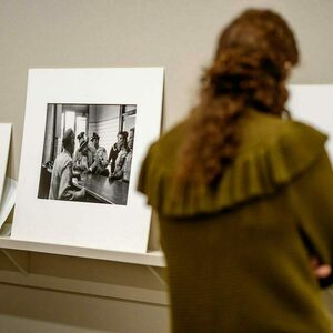 A woman looks at display of photos from the Civil Rights movement